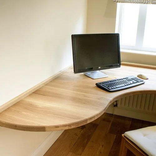 a photo showing a curved front gaming desk