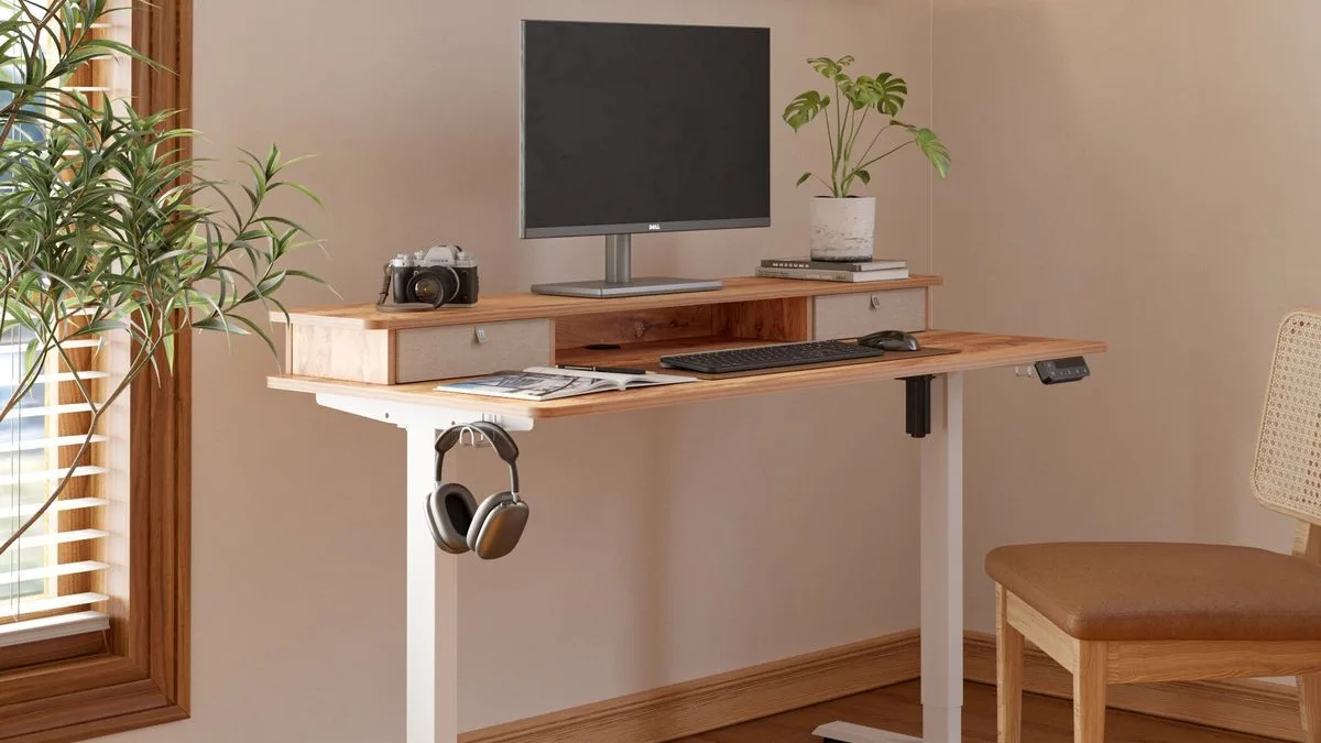 a photo showing a motorized/sit-stand gaming desk
